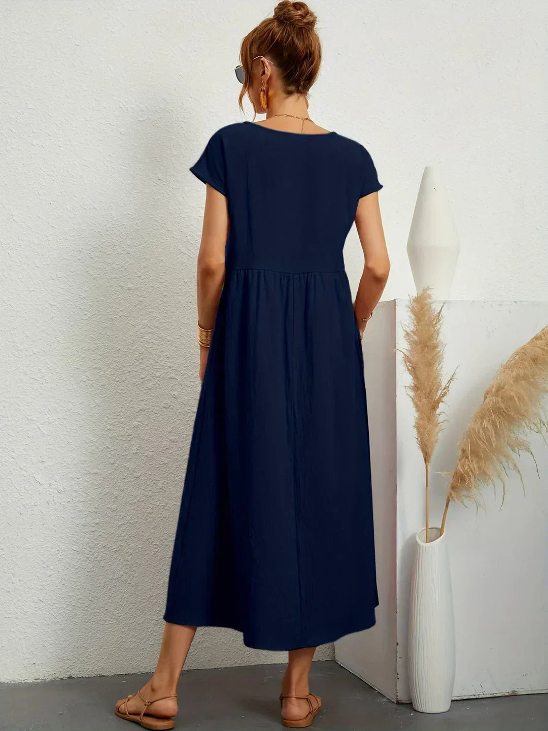 Abito midi fluido eleganza senza tempo