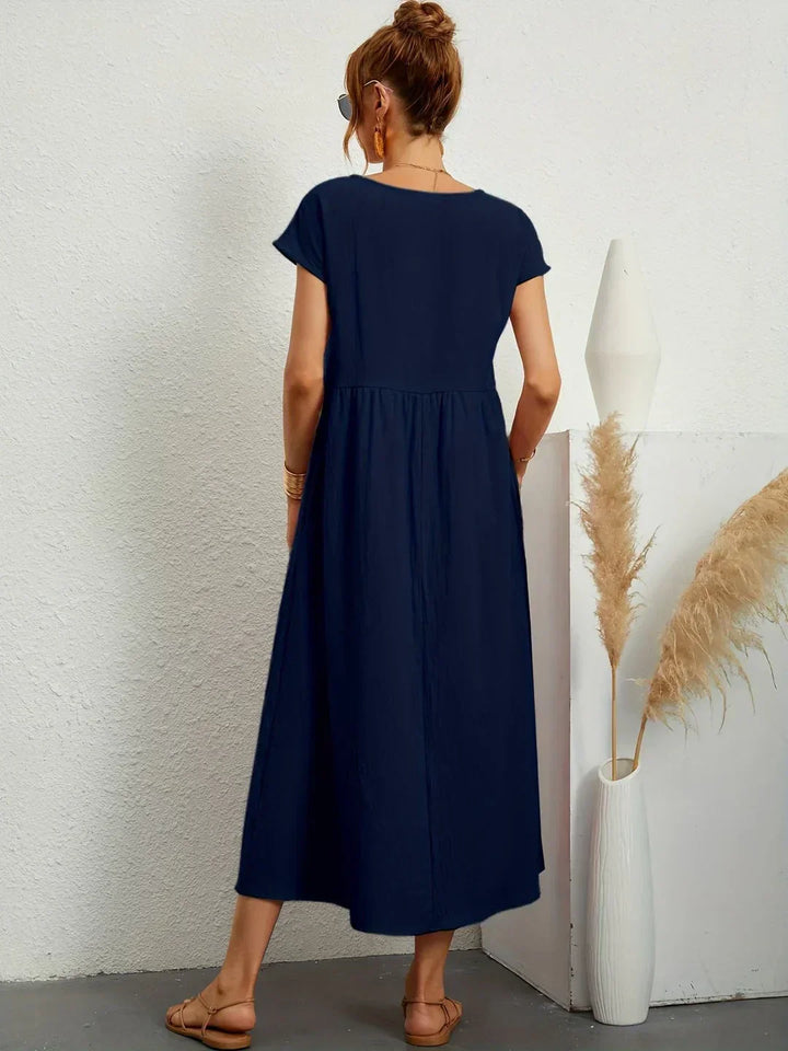 Abito midi fluido eleganza senza tempo