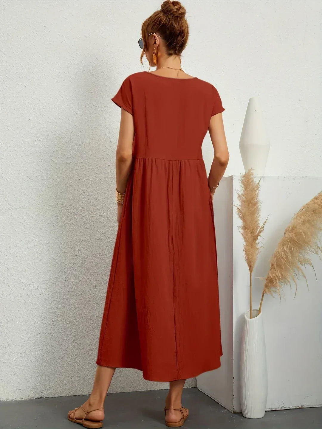 Abito midi fluido eleganza senza tempo