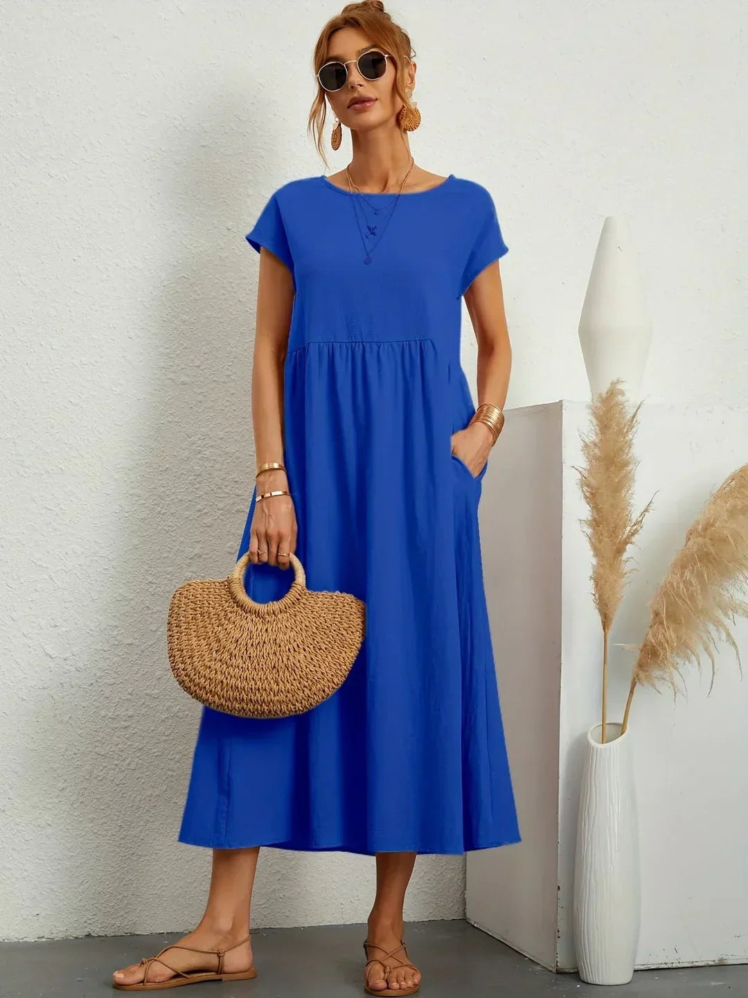 Abito midi fluido eleganza senza tempo