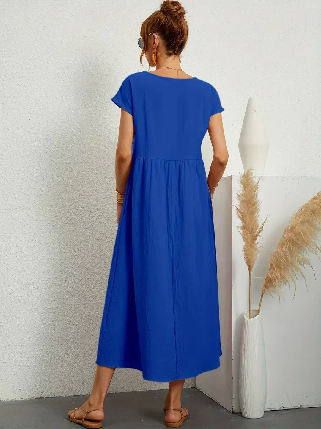 Abito midi fluido eleganza senza tempo