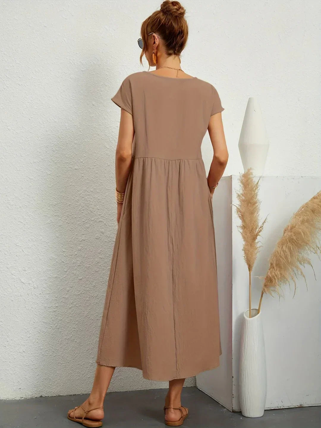 Abito midi fluido eleganza senza tempo