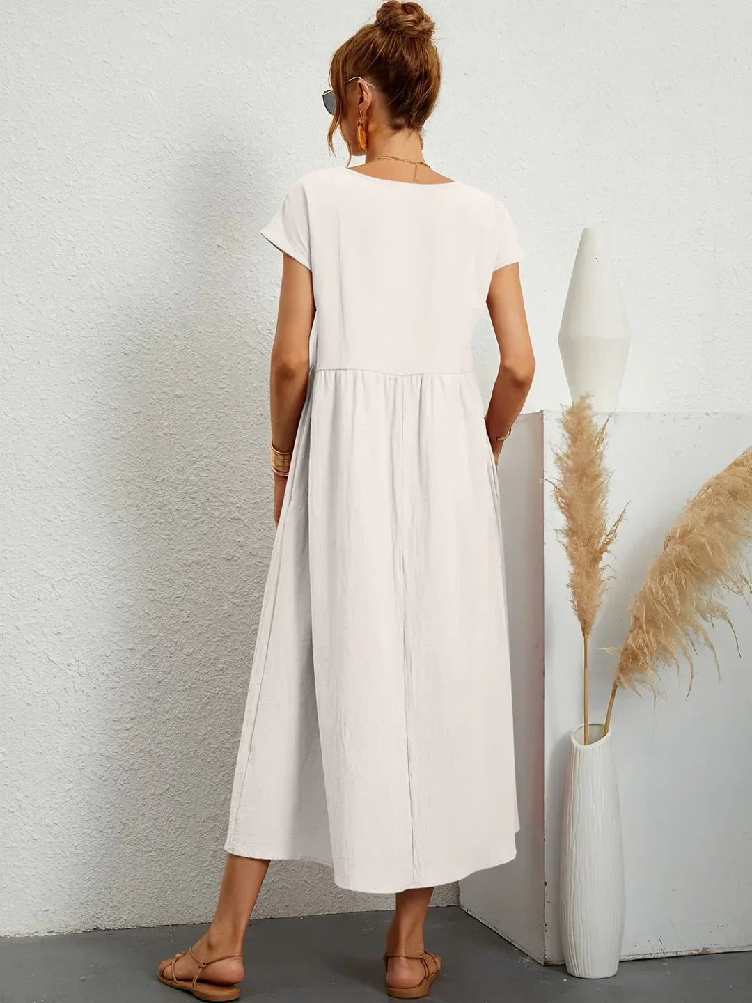 Abito midi fluido eleganza senza tempo