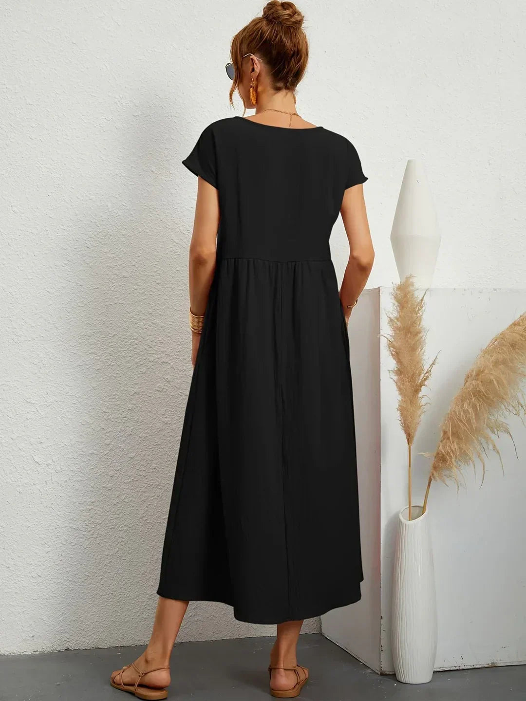 Abito midi fluido eleganza senza tempo