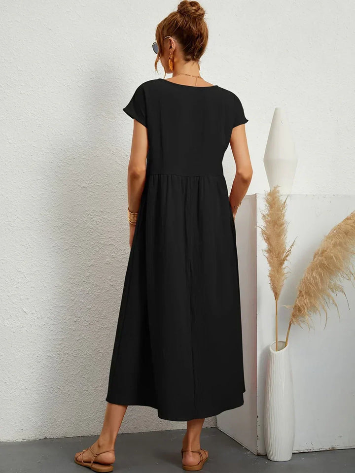 Abito midi fluido eleganza senza tempo